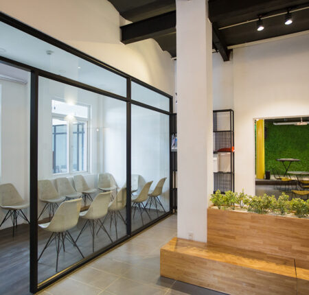 Nobody in office lobby with wooden bench