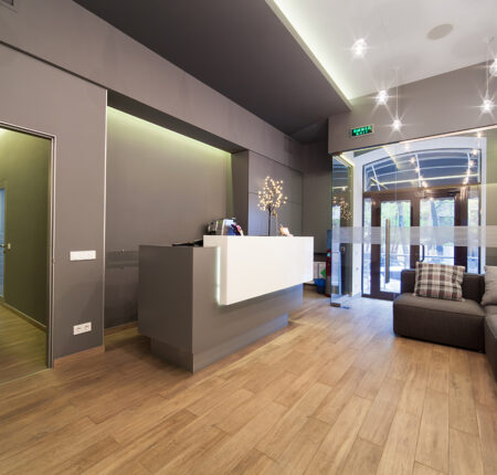 Lobby Entrance With Reception Desk In A Dental Clinic.