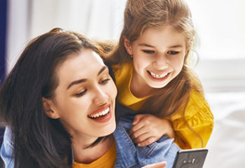 Happy loving family. Young mother and her daughter girl are play