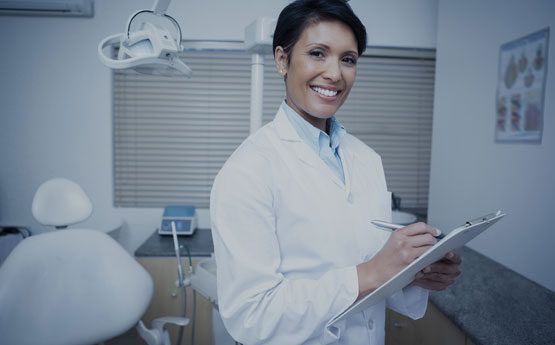 Dentist with clipboard