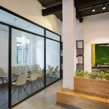 Nobody in office lobby with wooden bench